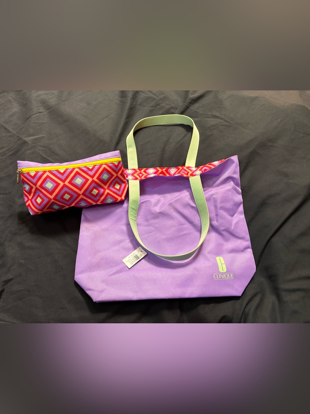 Clinique Purple Tote with Light Green Straps and Pink Geometric Liner
